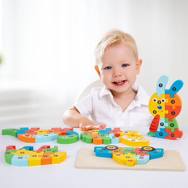 A child playing with a colorful wooden shape matching puzzle with animal and traffic shapes.