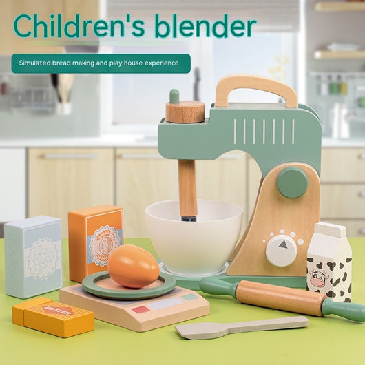 Children's toy blender set with kitchen utensils on a green surface