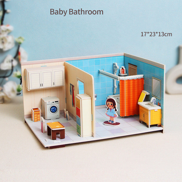 Miniature model of a baby bathroom with various fixtures and a child figure, on a light blue background.