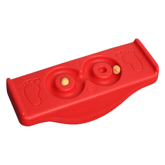 A bright yellow children's balance platform rock and roll seesaw toy with a few holes and small items placed on it.