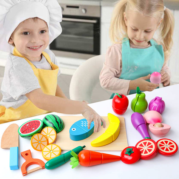 Two children playing with colorful toy kitchen set on a table.