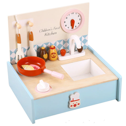 Children's toy kitchen set with sink, pan, and utensils on a white background