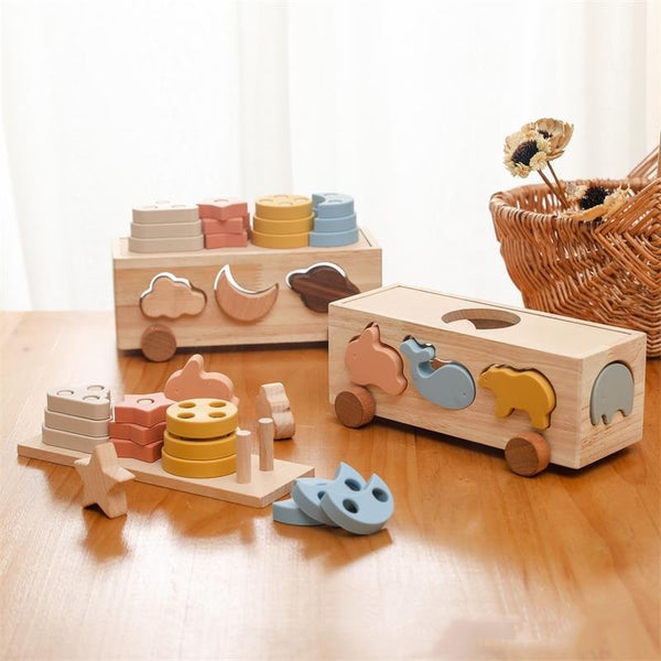 Set of wooden toys on a wooden surface with a wicker basket in the background.