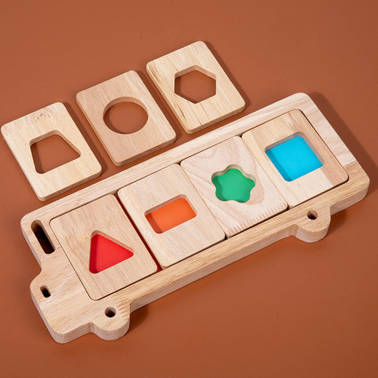 A child playing with a wooden 3D geometry puzzle that includes color sorting and matching shapes, with safe, sensory-friendly edges.