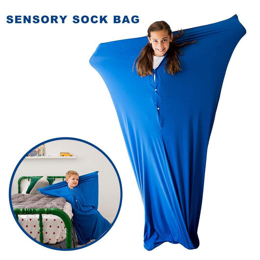 A blue sensory sock bag designed for children, shown being worn by a child and also displayed on a bed with a smaller inset image showing a child interacting with the bag.