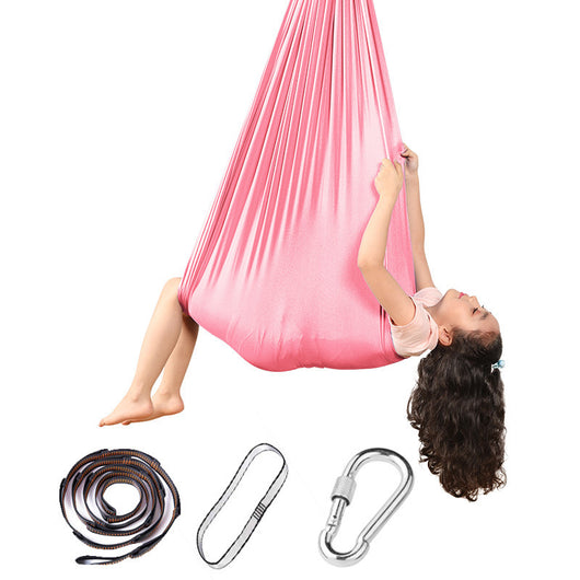 Pink aerial yoga hammock with accessories on a white background