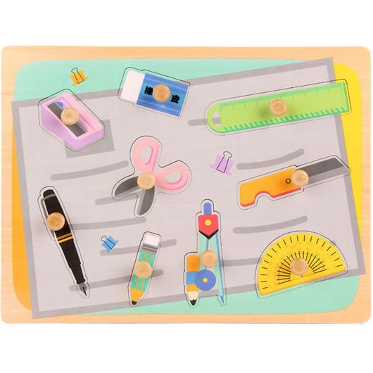 Set of colorful stationery items on a wooden board with a light blue background