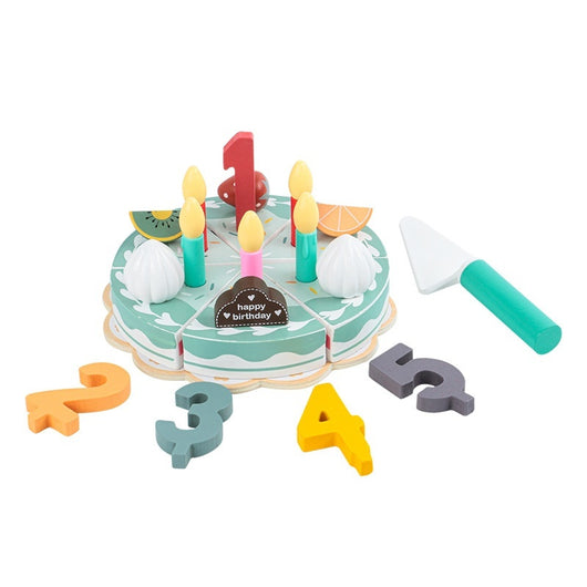 Toy birthday cake set with candles, letters, and a knife on a white background