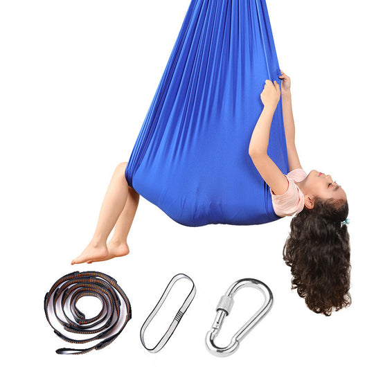 Person using a blue aerial yoga swing with accessories on a white background