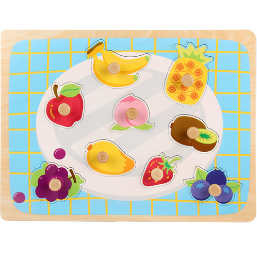 Children's puzzle with fruit shapes on a blue grid background