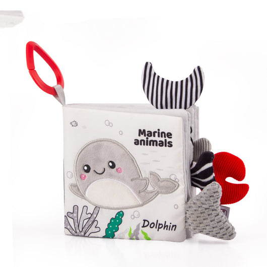 Children's soft book with marine animal illustrations on a white background
