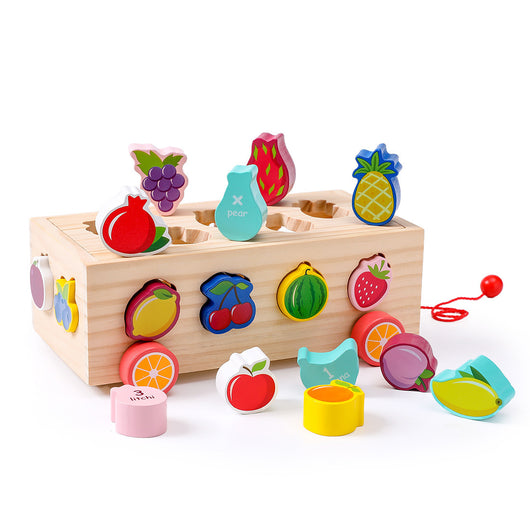 Wooden toy with colorful fruit-shaped blocks on a white background