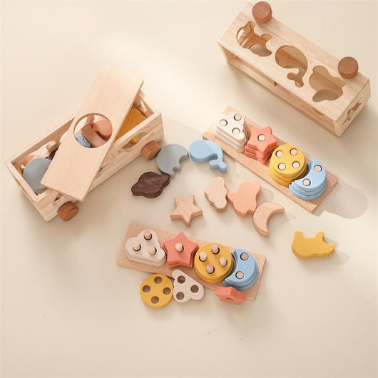 Wooden shape sorting toy with colorful shapes on a light background