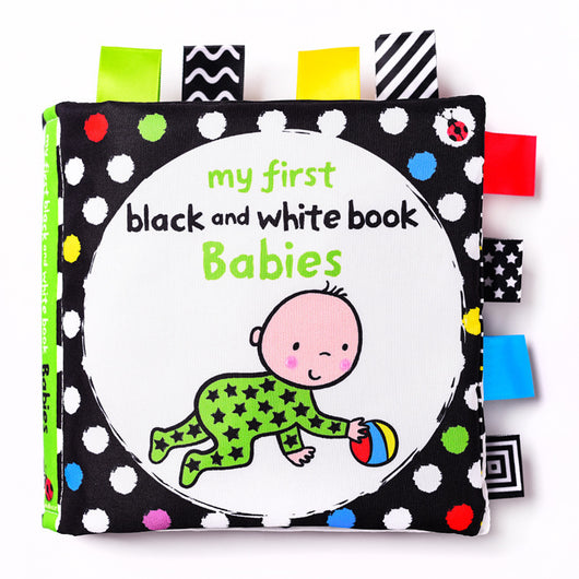 Children's book titled 'my first black and white book Babies' with colorful tabs on a white background
