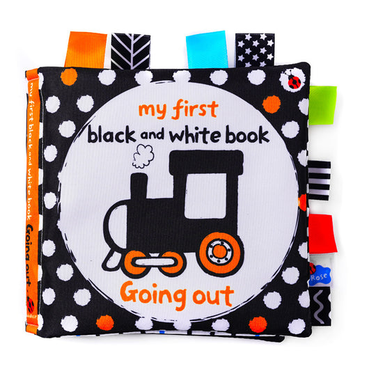 Children's soft book with train illustration and text on a white background