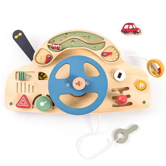 Wooden toy car dashboard with steering wheel and various controls on a white background