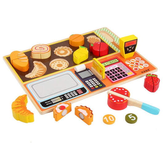 Toy cash register set with various food items on a white background