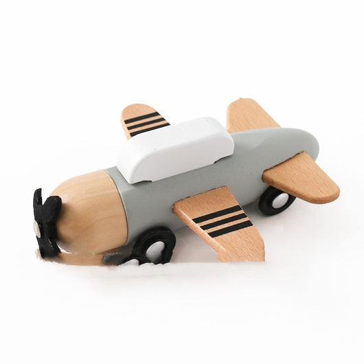Wooden toy airplane on a white background