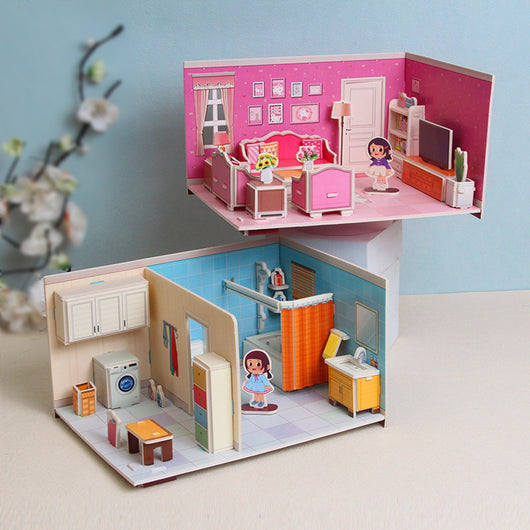 Toy dollhouse with two rooms, one pink and one blue, featuring furniture and dolls.