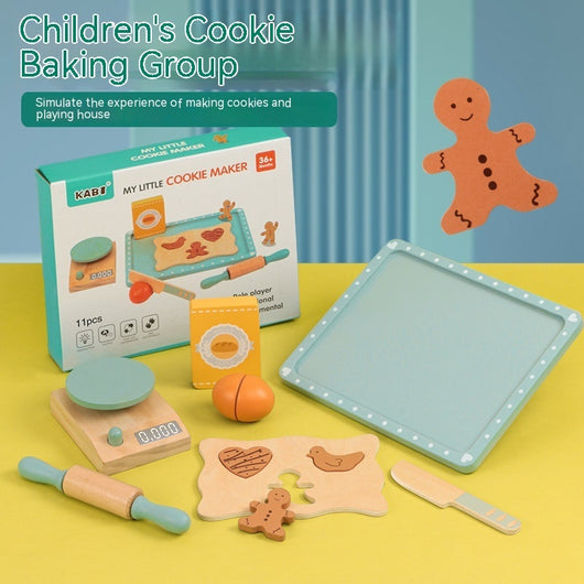 Children's cookie baking set with toy oven, tray, and gingerbread man on a yellow surface.