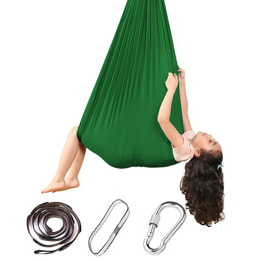 Green aerial yoga hammock with accessories on a white background