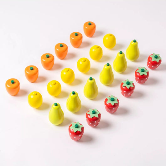 Colorful toy fruits and vegetables on a white background