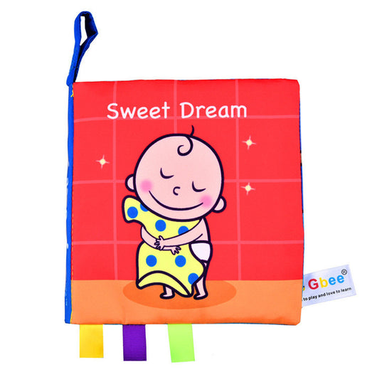 Children's soft book with cartoon baby and 'Sweet Dream' text on a red background