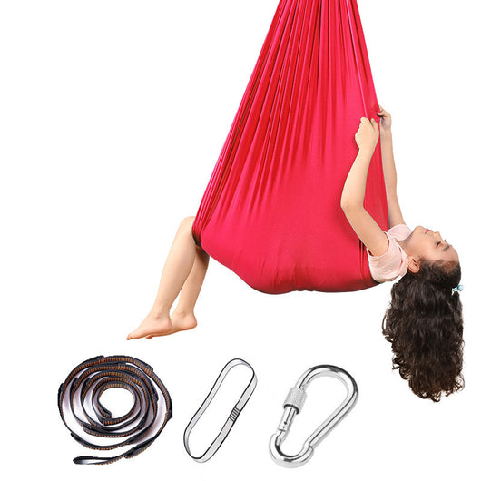 Red aerial yoga hammock with accessories on a white background