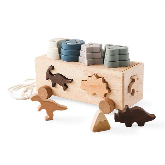 Wooden toy with shape sorter and animal figures on a white background